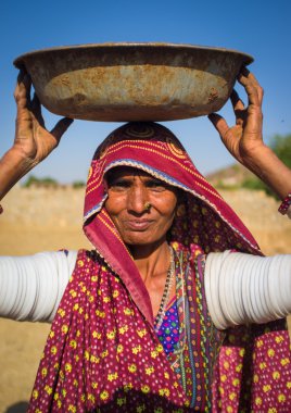 Rabari tribeswoman stands