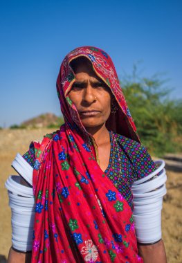 Rabari tribeswoman stands