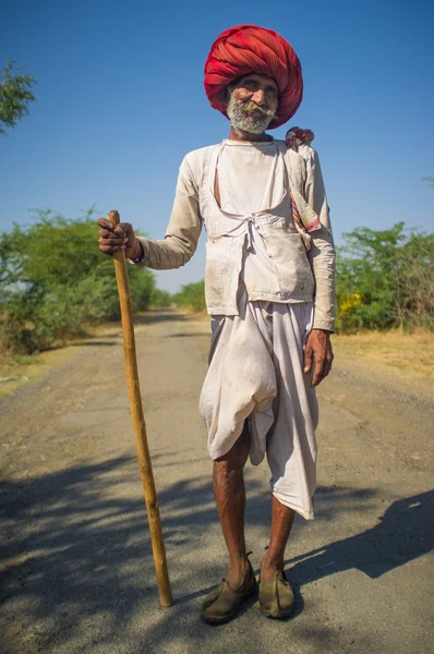 Tribesman with  cane stands — Zdjęcie stockowe