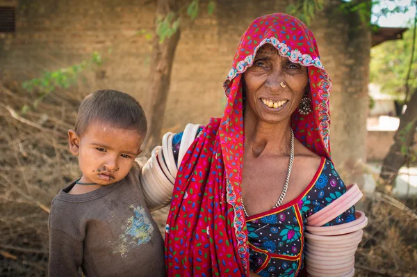 Elderly Indian woman holds baby — стокове фото