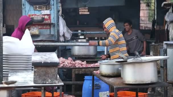 Men cutting raw chicken meat — Stock Video