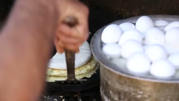 Man preparing traditional egg meal — Stock Video