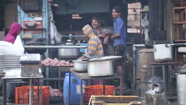 Men cutting raw chicken meat — Stock Video