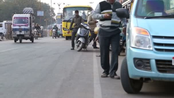 People and vehicles on  busy street — Stock Video