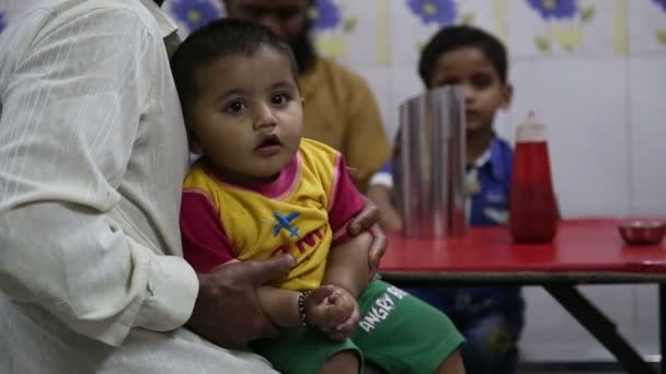 Indian baby held by a parent — Stock Video