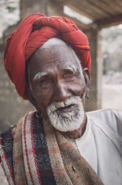 Blind Rabari tribesman sits