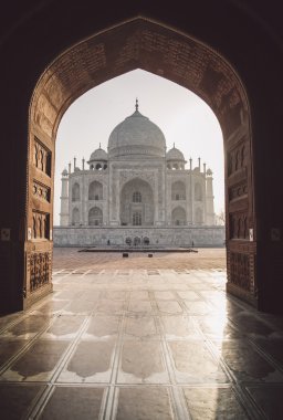Taj Mahal from mosque with sun reflection