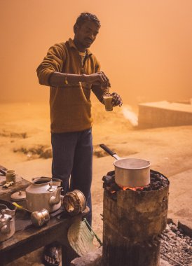 vendor prepares milky tea