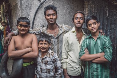 Boys from slum stand