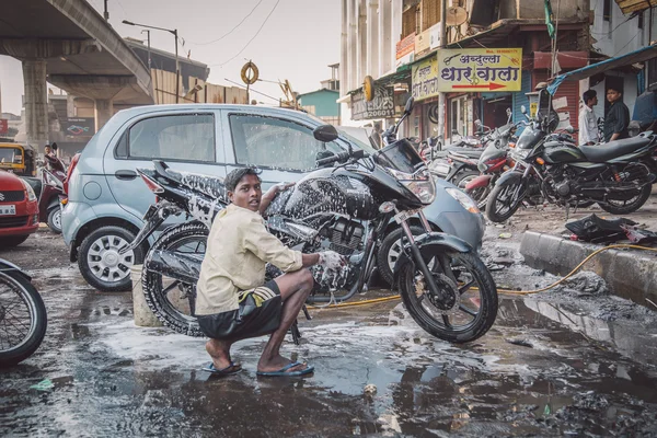 Boy hand washes motorbike — Stock Photo, Image