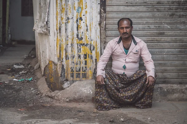 Indian man sits — стокове фото
