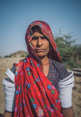 Rabari tribeswoman stands
