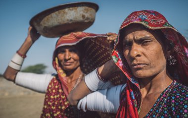Rabari tribeswomen stand