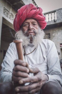 Rabari tribeswoman holds chillum