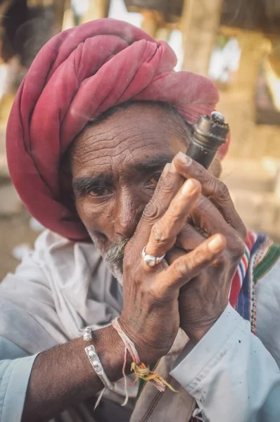 Tribesman smoking  chillum — 스톡 사진
