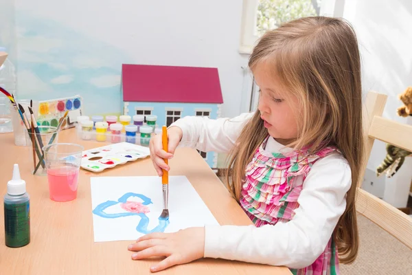 Little blonde girl painting — Stock Photo, Image