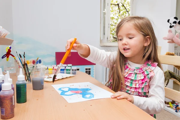 Little blonde girl painting — Stock Photo, Image