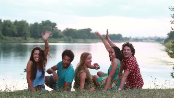 Friends sitting on grass — Stock Video