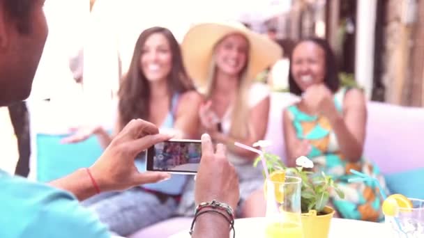 Man's hands taking pictures of women — Stock Video