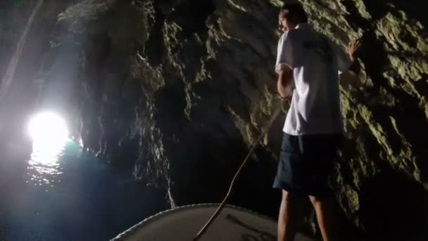 Tourists on boat tour inside the Blue cave — Stock Video