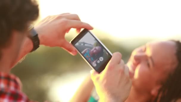 Man 's hands taking pictures of woman — стоковое видео