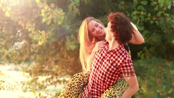 Man giving girlfriend a piggyback ride — Stock Video