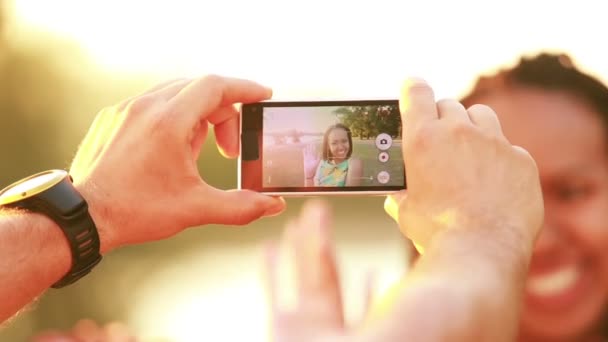 Man's hands taking pictures of woman — Stock Video