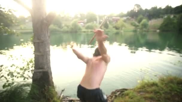 Man doing somersault jump into river — Stock Video