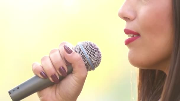 Woman's mouth singing with microphone — Stock Video