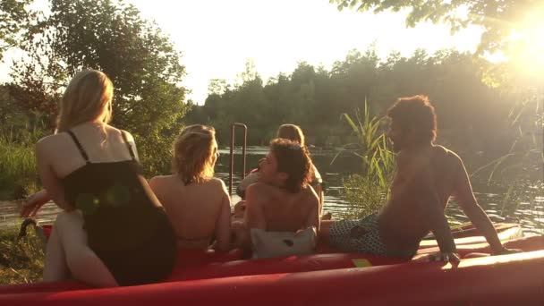 Friends resting by the river — Stock Video