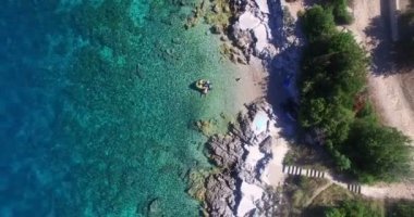 tourists at Martinscica beach on Island of Cres
