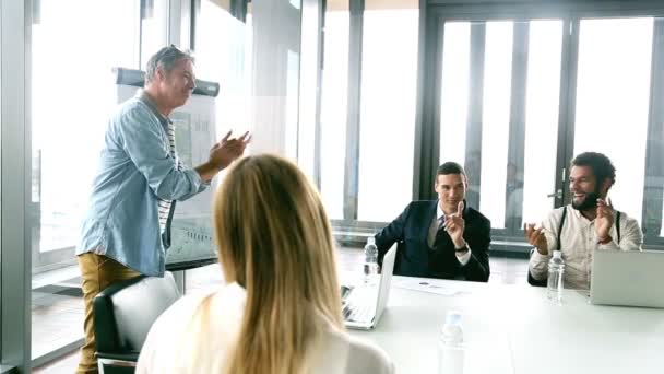 Colleagues clapping to young businessman — Stock Video