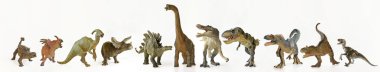 A Group of Eleven Dinosaurs in a Row clipart