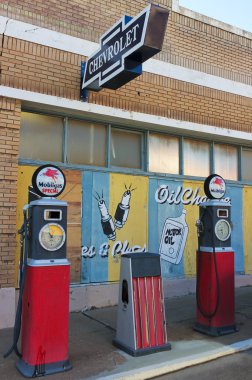 A Street Scene of Vintage Signs and Gas Pumps, Lowell, Arizona