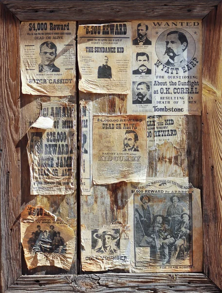 A Wooden Frame Full of Wanted Posters — Stock Photo, Image