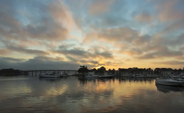 A Gorgeous Sunrise Over a Bridge and Marina — Stock Photo, Image