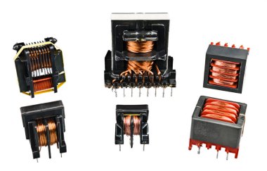 Set of isolation transformers with copper wire on inductors isolated on a white background. Electromagnetic coils in device for transfer energy in electrical circuits. Electronics industry components. clipart