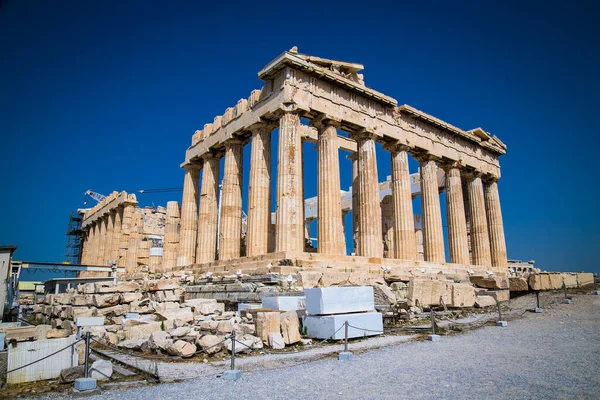 Parthenon on the Acropolis of Athens, Greece. The famous ancient Greek Parthenon is the main landmark of Athens. Ruins of Parthenon or temple of Athena at the top of mountain