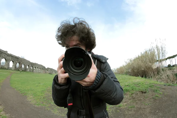 Velký objektiv fotograf — Stock fotografie