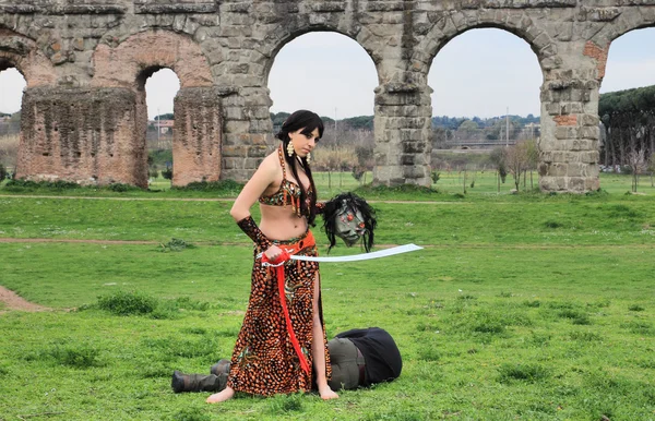 Oriental odalisque with sword — Stock Photo, Image