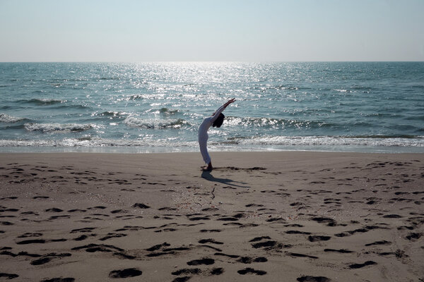 Yoga pose at the beach