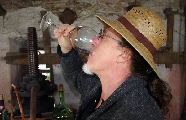 Winemaker drinking red wine — Stok fotoğraf