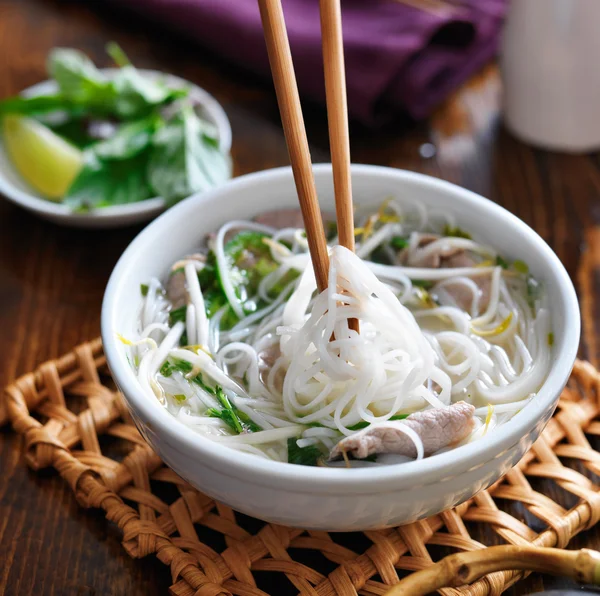 Bowl of pho with beef — Stock Photo © resnick_joshua1 54229939