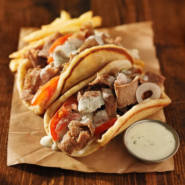 Greek gyros with tzatziki sauce — Stock Photo, Image