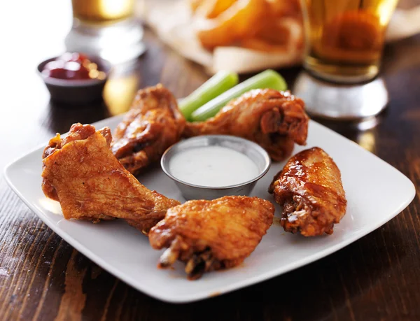 Bbq buffalo chicken wings with celery — Stock Photo, Image
