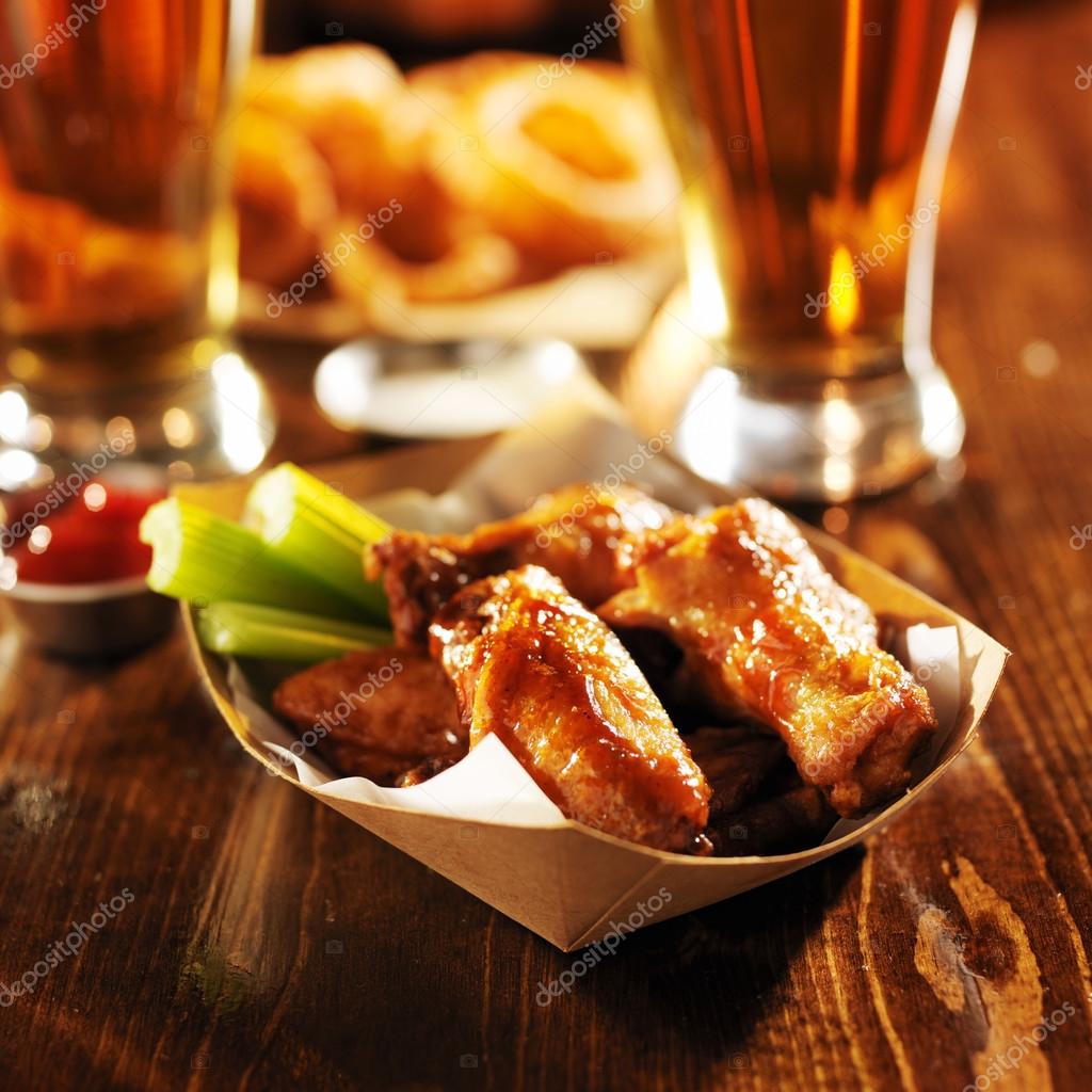 Buffalo chicken wings in basket with celery Stock Photo by ©resnick