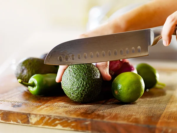 Ingredients to make guacamole in kitchen — Stock Photo, Image