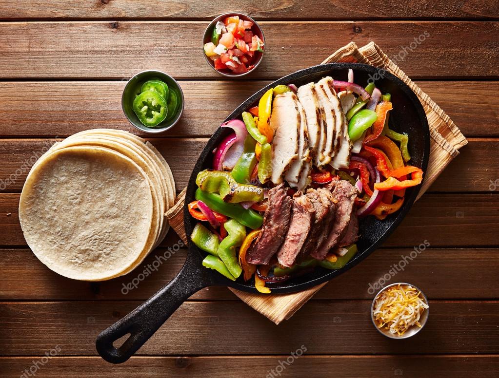 Mexican steak and chicken fajitas Stock Photo by ©resnick_joshua1 86857594