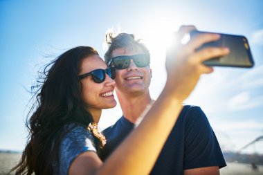 smiling couple taking selfies clipart