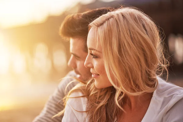 Pretty girl cuddling with boyfriend — Stock Photo, Image